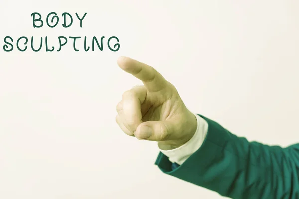 Word writing text Body Sculpting. Business concept for activity of increasing the body s is visible muscle tone Isolated hand pointing with finger. Business concept pointing finger.