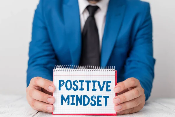 Word writing text Positive Mindset. Business concept for mental attitude in wich you expect favorable results Man holds empty paper with copy space in front of him Space.