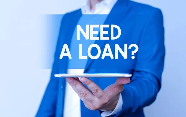 Handwriting text Need A Loan Question. Concept meaning asking he need money expected paid back with interest Man in the blue suite and white shirt holds mobile phone in the hand. — Stock Photo, Image