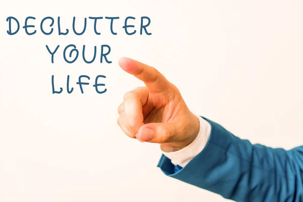 Texto de escritura de palabras De Clutter Your Life. Concepto de negocio para eliminar elementos innecesarios de lugares desordenados o hacinados Mano aislada apuntando con el dedo. Concepto de negocio señalando dedo . — Foto de Stock