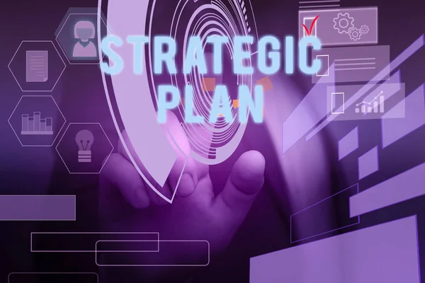 Text sign showing Strategic Plan. Conceptual photo a systematic process of envisioning a desired future Male human wear formal work suit presenting presentation using smart device. — Stock Photo, Image