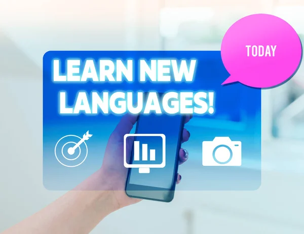 Conceptual hand writing showing Learn New Languages. Business photo text developing ability to communicate in foreign lang woman smartphone speech bubble office supplies technology.