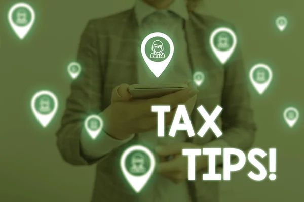 Handwriting text writing Tax Tips. Concept meaning compulsory contribution to state revenue levied by government Woman wear formal work suit presenting presentation using smart device. — Stock Photo, Image