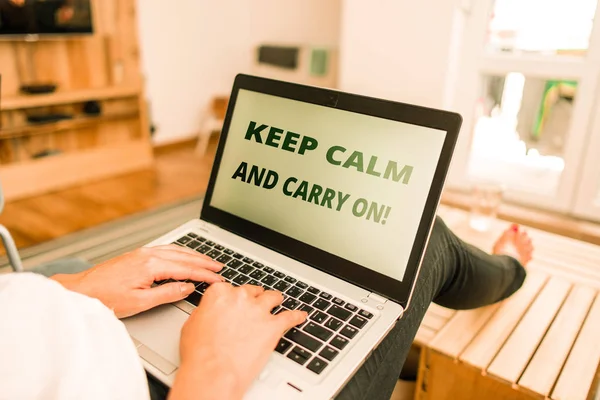 Word writing text Keep Calm And Carry On. Business concept for slogan calling for persistence face of challenge woman laptop computer office supplies technological devices inside home.