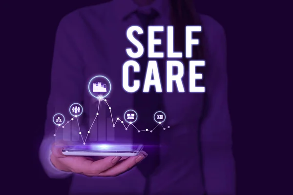 Text sign showing Self Care. Conceptual photo the practice of taking action to improve one s is own health Woman wear formal work suit presenting presentation using smart device. — Stock Photo, Image