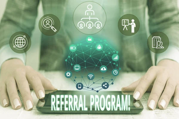 Conceptual hand writing showing Referral Program. Business photo text internal recruitment method employed by organizations Female human wear formal work suit presenting smart device. — Stock Photo, Image