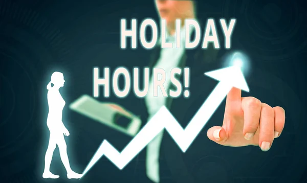 Text sign showing Holiday Hours. Conceptual photo Overtime work on for employees under flexible work schedules Female human wear formal work suit presenting presentation use smart device.