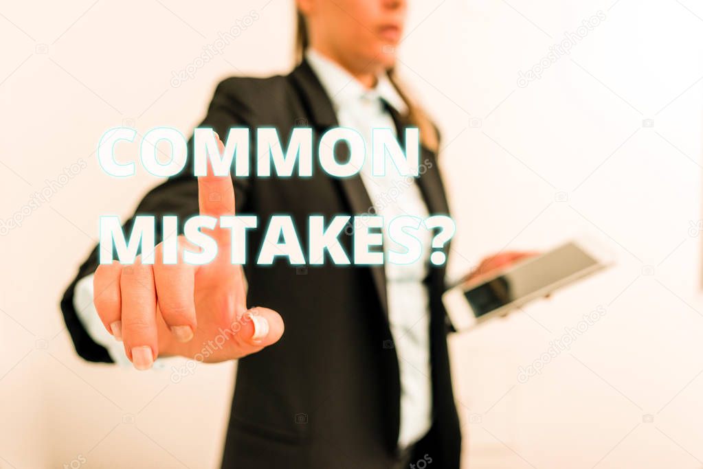 Conceptual hand writing showing Common Mistakes question. Business photo text repeat act or judgement misguided or wrong Digital business in black suite concept with business woman.