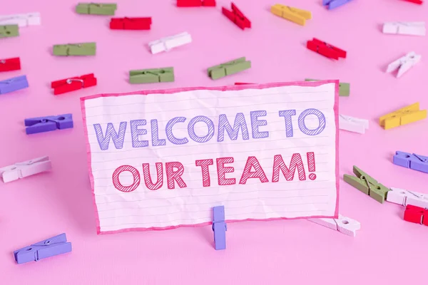 Text sign showing Welcome To Our Team. Conceptual photo introducing another demonstrating to your team mates Colored clothespin papers empty reminder pink floor background office pin. — Stock Photo, Image