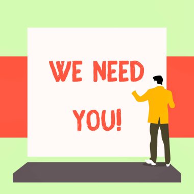 El yazısı metin yazma We Need You. Kavram belirli bir iş ya da hedef için birlikte çalışmak için birinden soran anlamı Boş dikdörtgen bakan takım elbise li genç adam giyinmiş.