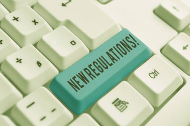 Kelime yazma metni Yeni Düzenlemeler. Kurallar için Iş kavramı hükümet sipariş kontrolü yapılan bir şey beyaz arka plan tuşu kopyalama alanı üzerinde boş not kağıdı ile Beyaz pc klavye yaptı.
