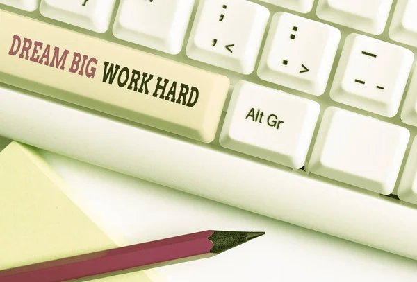 Word writing text Dream Big Work Hard. Business concept for Believe in yourself and follow the dreams and goals White pc keyboard with empty note paper above white background key copy space.