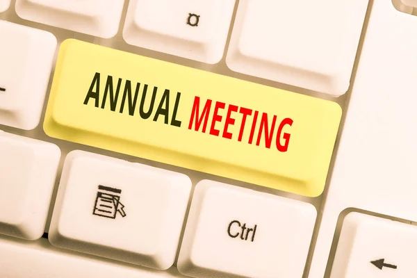 Text sign showing Annual Meeting. Conceptual photo yearly meeting of the general membership of an organization White pc keyboard with empty note paper above white background key copy space.