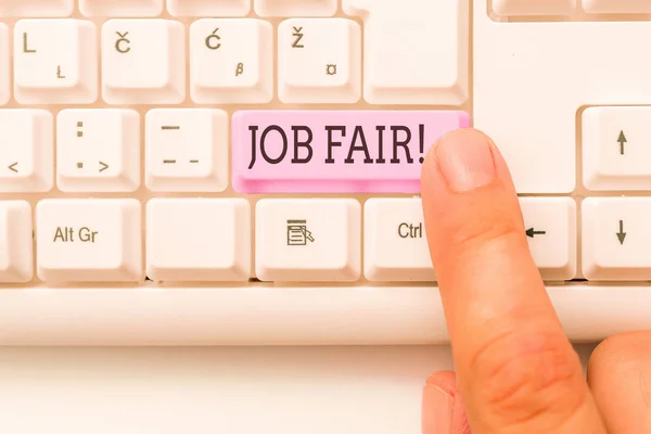 Handwriting text writing Job Fair. Concept meaning event in which employers recruiters give information to employees White pc keyboard with empty note paper above white background key copy space.