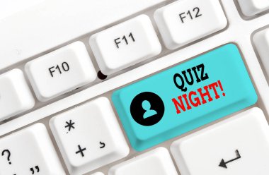 Conceptual hand writing showing Quiz Night. Business photo showcasing evening test knowledge competition between individuals White pc keyboard with note paper above the white background. clipart