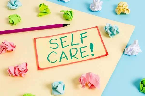 Writing note showing Self Care. Business photo showcasing practice of taking action preserve or improve ones own health Colored crumpled papers empty reminder blue yellow clothespin. — Stock Photo, Image