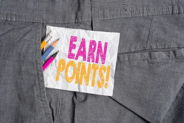 Text sign showing Earn Points. Conceptual photo collecting scores in order qualify to win big prize Writing equipment and white note paper inside pocket of man work trousers.