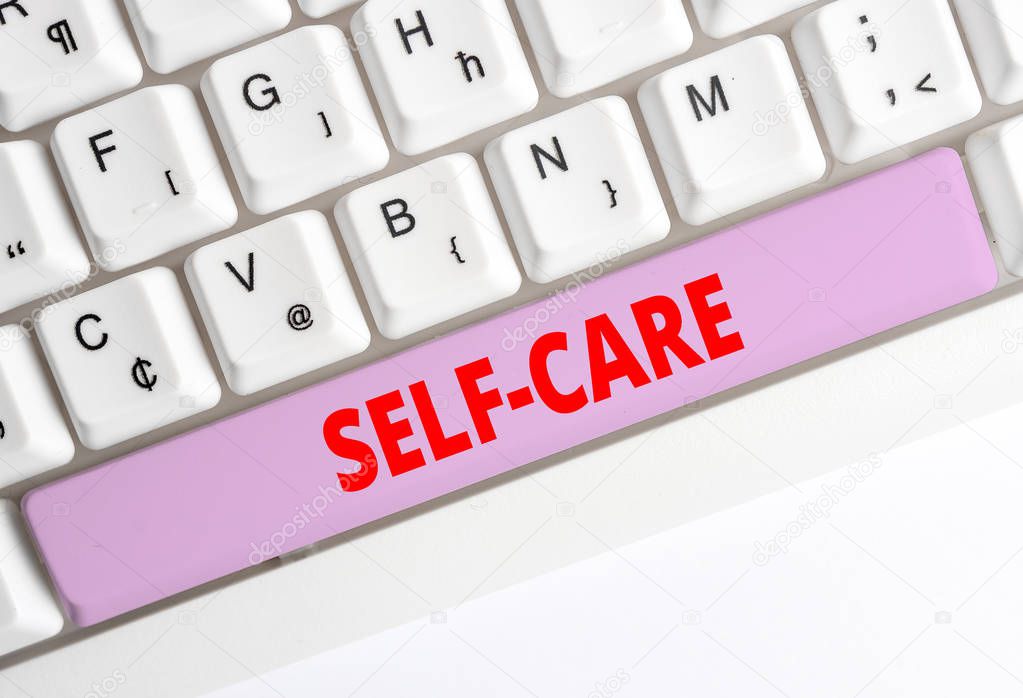 Handwriting text writing Self Care. Concept meaning practice of taking action preserve or improve ones own health White pc keyboard with empty note paper above white background key copy space.
