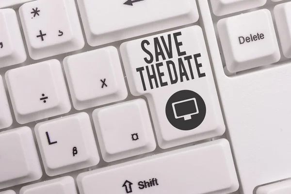 Text sign showing Save The Date question. Conceptual photo asking someone to remember specific day or time White pc keyboard with empty note paper above white background key copy space.
