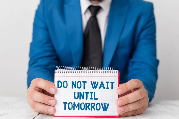 Word writing text Do Not Wait Until Tomorrow. Business concept for needed to do it right away Urgent Better do now Man holds empty paper with copy space in front of him Space. — Stock Photo, Image