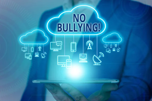 Handwriting text writing No Bullying. Concept meaning stop aggressive behavior among children power imbalance Male human wear formal work suit presenting presentation using smart device.