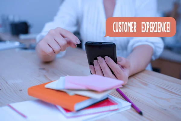 Word writing text Customer Experience. Business concept for product of interaction between organization and buyer woman using smartphone office supplies technological devices inside home. — Stock Photo, Image