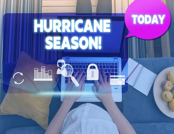 Conceptual hand writing showing Hurricane Season. Business photo text time when most tropical cyclones are expected to develop woman smartphone speech bubble office supplies technology.