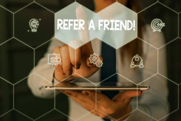 Writing note showing Refer A Friend. Business photo showcasing direct someone to another or send him something like gift Woman wear formal work suit presenting presentation using smart device. — Stock Photo, Image