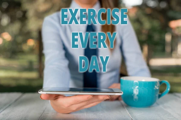 Handwriting text Exercise Every Day. Concept meaning move body energetically in order to get fit and healthy Business woman sitting by the table with cup of coffee and mobile phone.