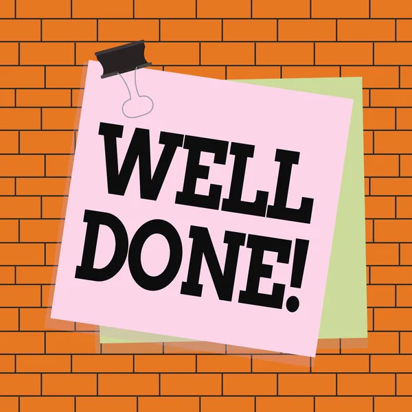 Text sign showing Well Done. Conceptual photo used praising demonstrating or group for something have done good way Paper stuck binder clip colorful background reminder memo office supply.