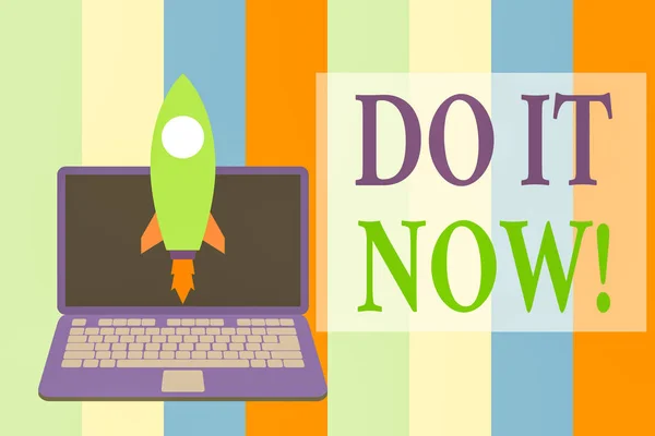 Writing note showing Do It Now. Business photo showcasing not hesitate and start working or doing stuff right away Launching rocket up laptop Startup Developing goal objective.