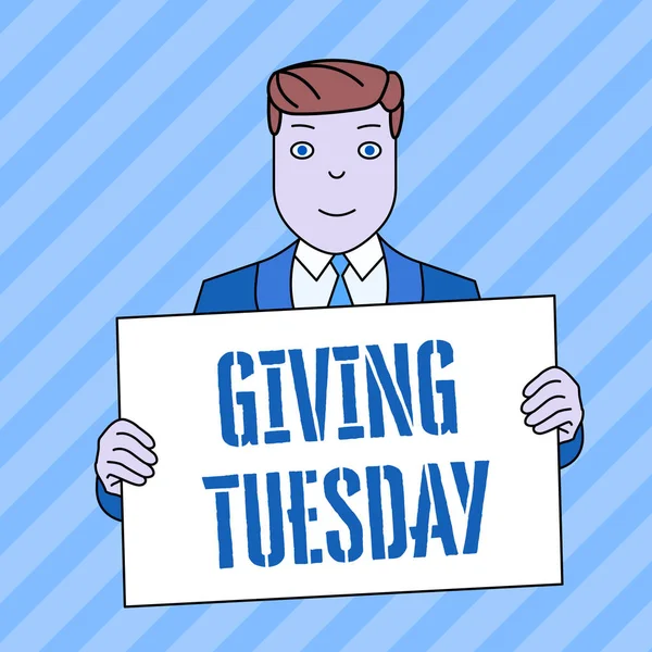 Conceptual hand writing showing Giving Tuesday. Business photo showcasing international day of charitable giving Hashtag activism Smiling Man Holding Suit Poster Board in Front of Himself.