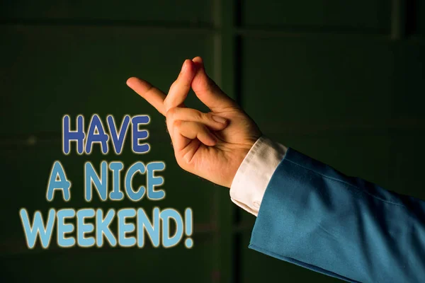 Text sign showing Have A Nice Weekend. Conceptual photo wishing someone that something nice happen holiday Isolated hand pointing with finger. Business concept pointing finger. — Stock Photo, Image