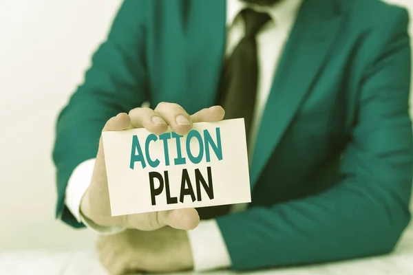 Handwriting text writing Action Plan. Concept meaning detailed plan outlining actions needed to reach goals or vision Man holds empty paper with copy space in front of him Space. — Stock Photo, Image