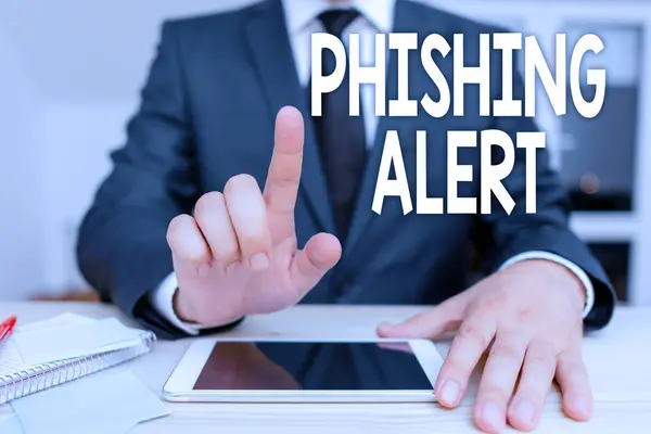 Textzeichen mit Phishing Alert. Begriffsbild bewusst auf betrügerischen Versuch, an sensible Informationen zu gelangen. — Stockfoto