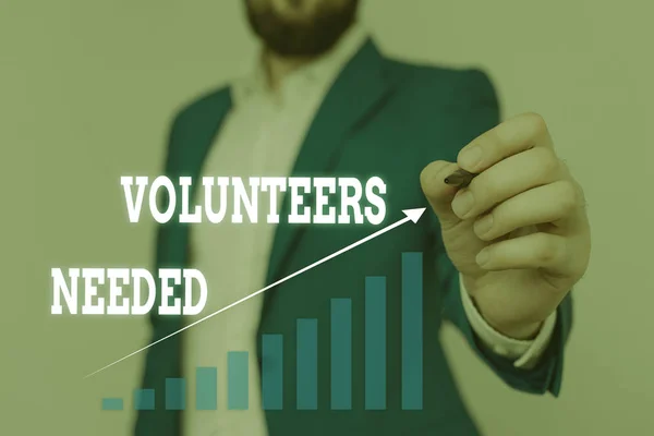 Text sign showing Volunteers Needed. Conceptual photo need work or help for organization without being paid Male human wear formal work suit presenting presentation using smart device.