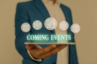 Text sign showing Coming Events. Conceptual photo Happening soon Forthcoming Planned meet Upcoming In the Future Male human wear formal work suit presenting presentation using smart device. clipart