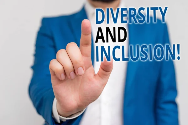 Word writing text Diversity And Inclusion. Business concept for range huanalysis difference includes race ethnicity gender Businessman in blue suite and white shirt pointing with finger in empty space