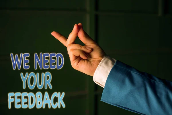 Text sign showing We Need Your Feedback. Conceptual photo criticism given to say can be done improvement Isolated hand pointing with finger. Business concept pointing finger.