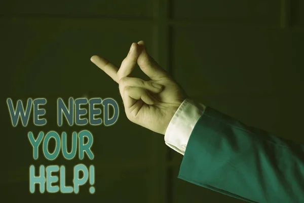 Text sign showing We Need Your Help. Conceptual photo asking someone to stand with you against difficulty Isolated hand pointing with finger. Business concept pointing finger.