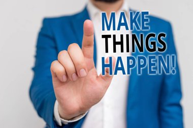 Word writing text Make Things Happen. Business concept for you will have to make hard efforts in order to achieve it Businessman in blue suite and white shirt pointing with finger in empty space.