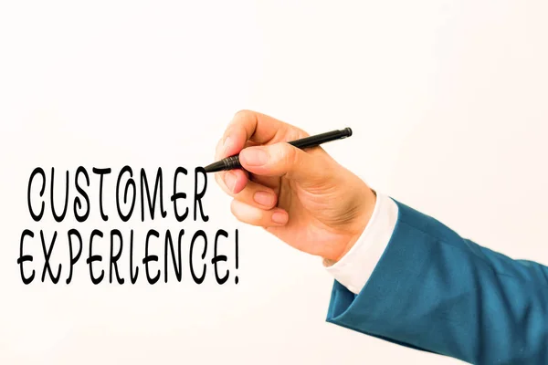Text sign showing Customer Experience. Conceptual photo product of interaction between organization and buyer Isolated hand above white background. Pointing pen in the hand on white background.