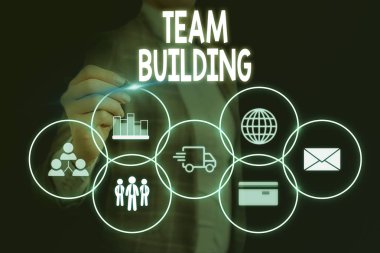 Word writing text Team Building. Business concept for various types of activities used to enhance social relations Woman wear formal work suit presenting presentation using smart device.