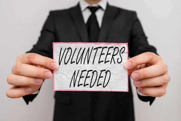 Text sign showing Volunteers Needed. Conceptual photo need work or help for organization without being paid.