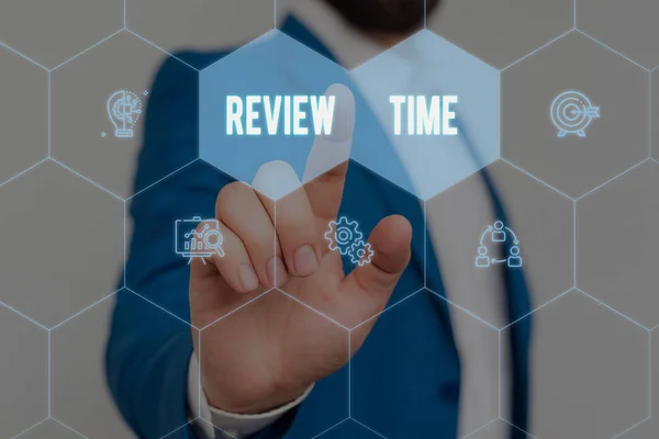 Text sign showing Review Time. Conceptual photo to think or talk about something again Set schedule to review Male human wear formal work suit presenting presentation using smart device. — Stock Photo, Image