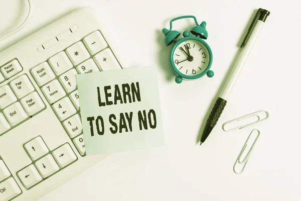 Conceptual hand writing showing Learn To Say No. Business photo text decline or refuse few things before you destroy yourself White pc keyboard with empty note paper above white background. — 스톡 사진