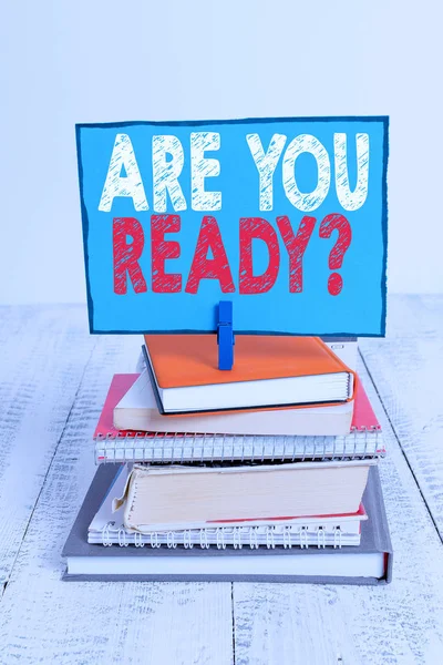 Writing note showing Are You Ready Question. Business photo showcasing used telling someone start something when feel prepared pile stacked books notebook pin color reminder white wooden. — Stock Photo, Image