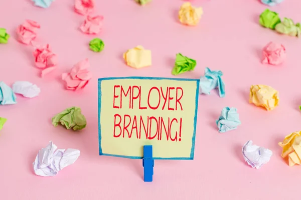 Text sign showing Employer Branding. Conceptual photo promoting company employer choice to desired target group Colored crumpled papers empty reminder pink floor background clothespin.
