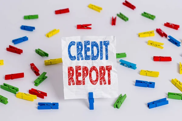 Text sign showing Credit Report. Conceptual photo Borrowing Rap Sheet Bill and Dues Payment Score Debt History Colored clothespin papers empty reminder white floor background office.