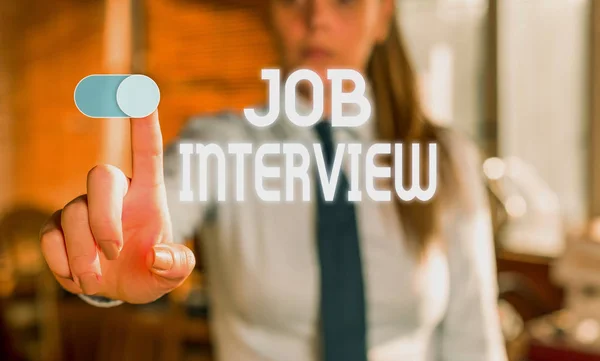 Text sign showing Job Interview. Conceptual photo Assessment Questions Answers Hiring Employment Panel Blurred woman in the background pointing with finger in empty space. — Stockfoto